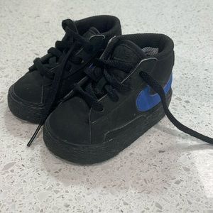 NWOT Nike High Tops size 3C black with blue swoosh.